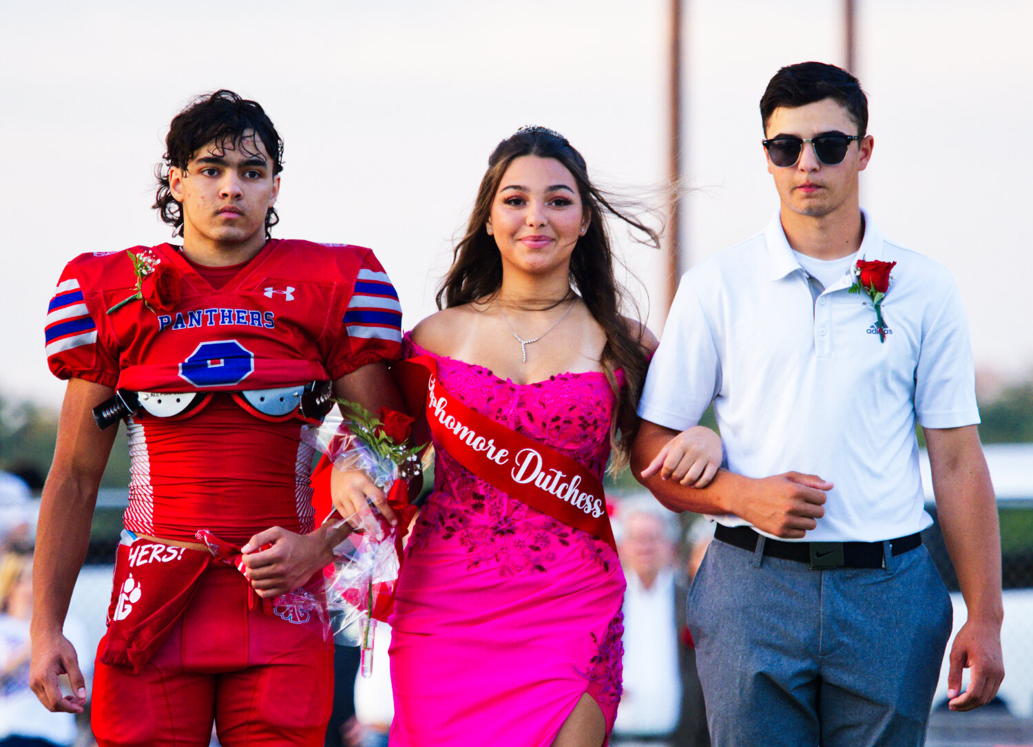 Sophomore class duchess Piper Hallman is escorted by her brothers Jake, who went on to have a stellar game, and Nick, an assistant coach for Alba-Golden. [preview plenty of panther pictures]